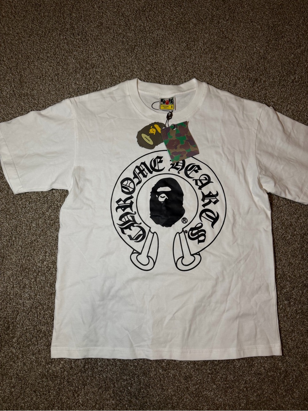 White Short-Sleeve Graphic Tee with Black Crest Logo